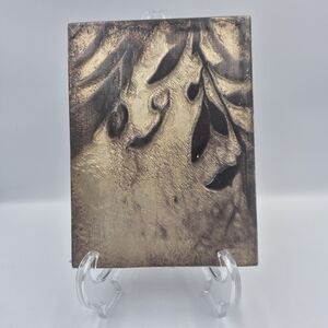 Equinox" tile (No. T268), which features a textured design of leaves in bronze